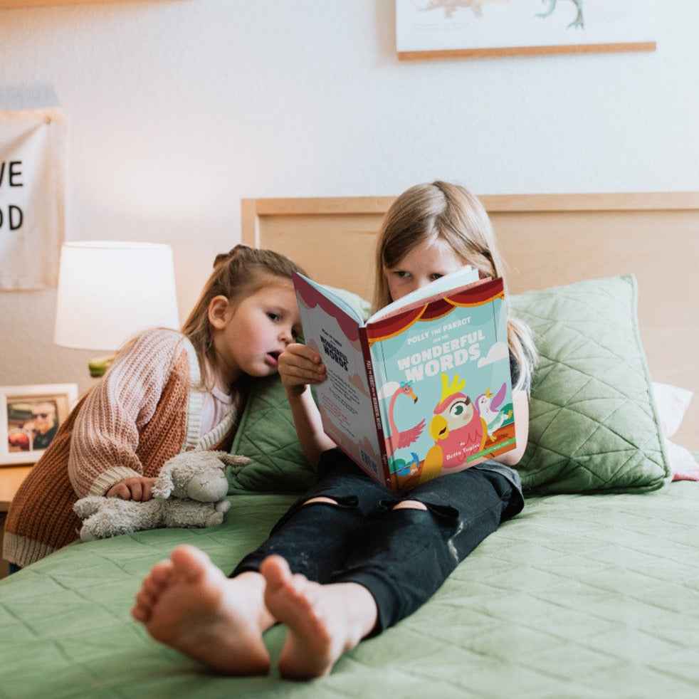 Kids reading Polly the Parrot and the Wonderful Words, one of the best Christian books for kids about using kind words.